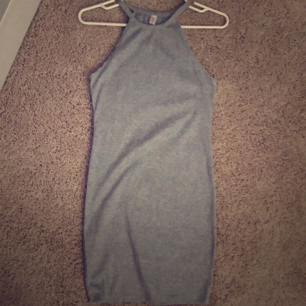 Grey body-con high neck dress.